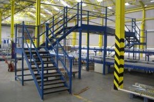 Bespoke mezzanine structure - stairs and platform spanning over a conveyor belt