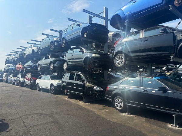 Scrap vehicles stored on a Wickens car rack