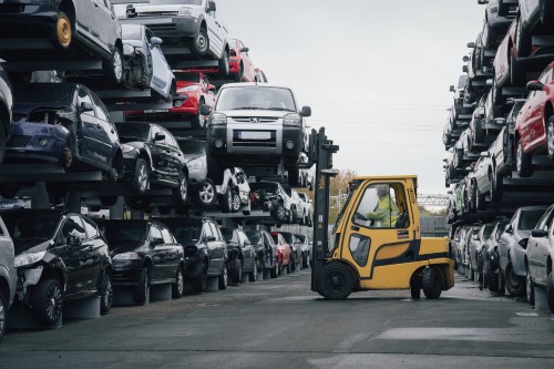 A forklift truck loading a car onto Wickens car racking storage system